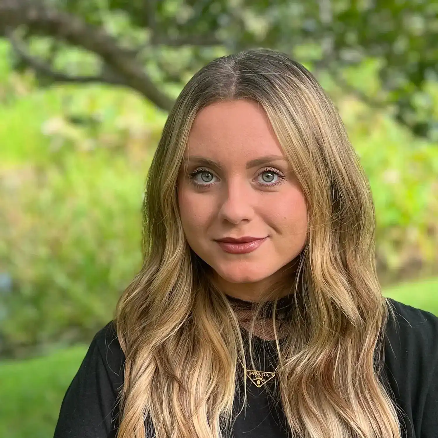 Portrait of Sami Brooke, a professional stylist at Grey and Sage Salon, showcasing their expertise and style.