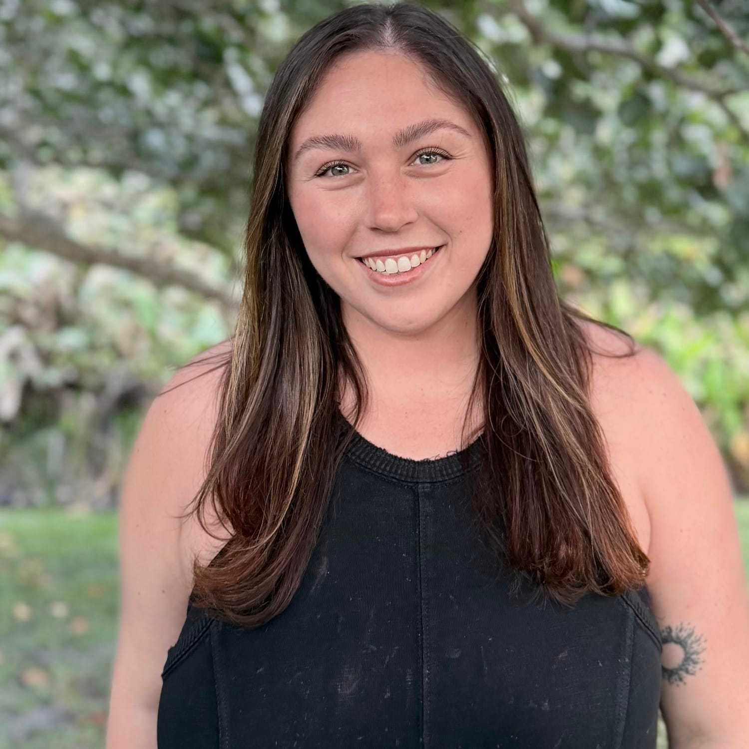 Portrait of Alexa Azzinaro, a professional stylist at Grey and Sage Salon, showcasing their expertise and style.