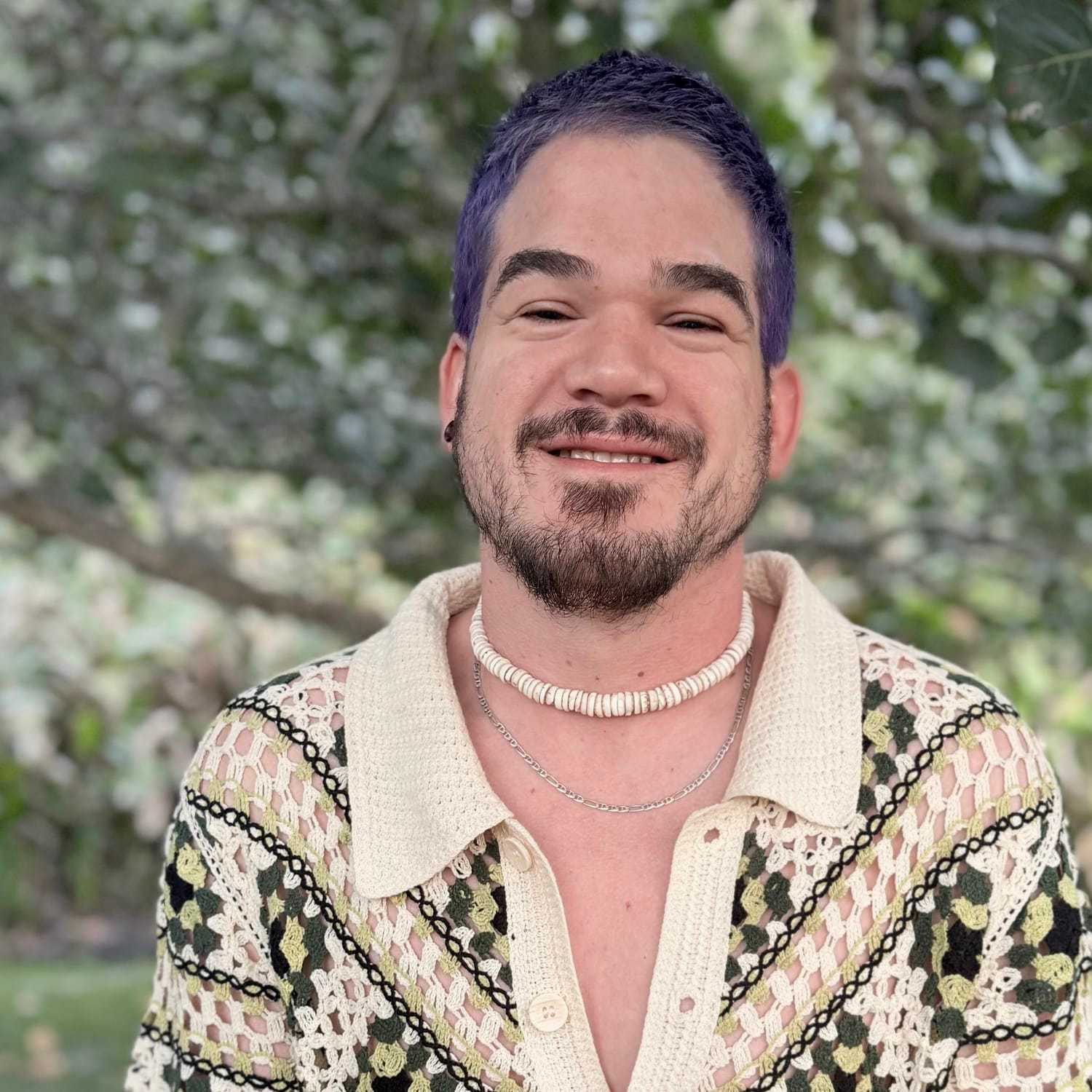 Portrait of Alex Pimentel, a professional stylist at Grey and Sage Salon, showcasing their expertise and style.