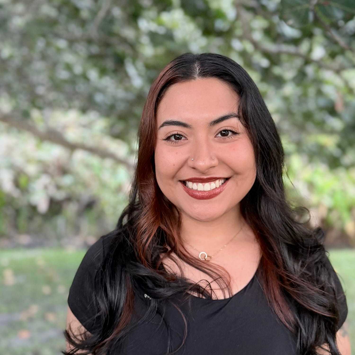 Portrait of Melanie Mejia, a professional stylist at Grey and Sage Salon, showcasing their expertise and style.