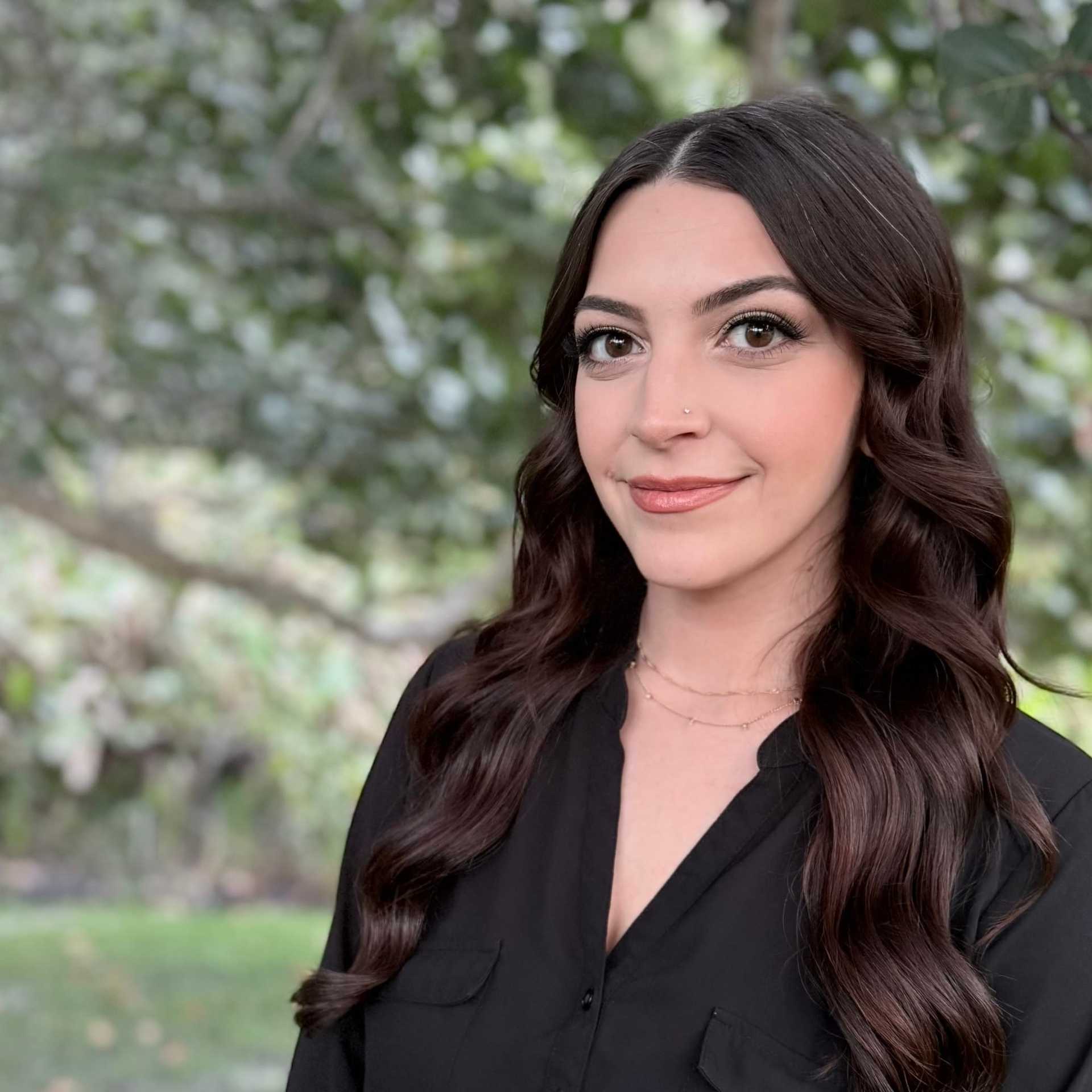 Portrait of Aly Spadavecchia, a professional stylist at Grey and Sage Salon, showcasing their expertise and style.