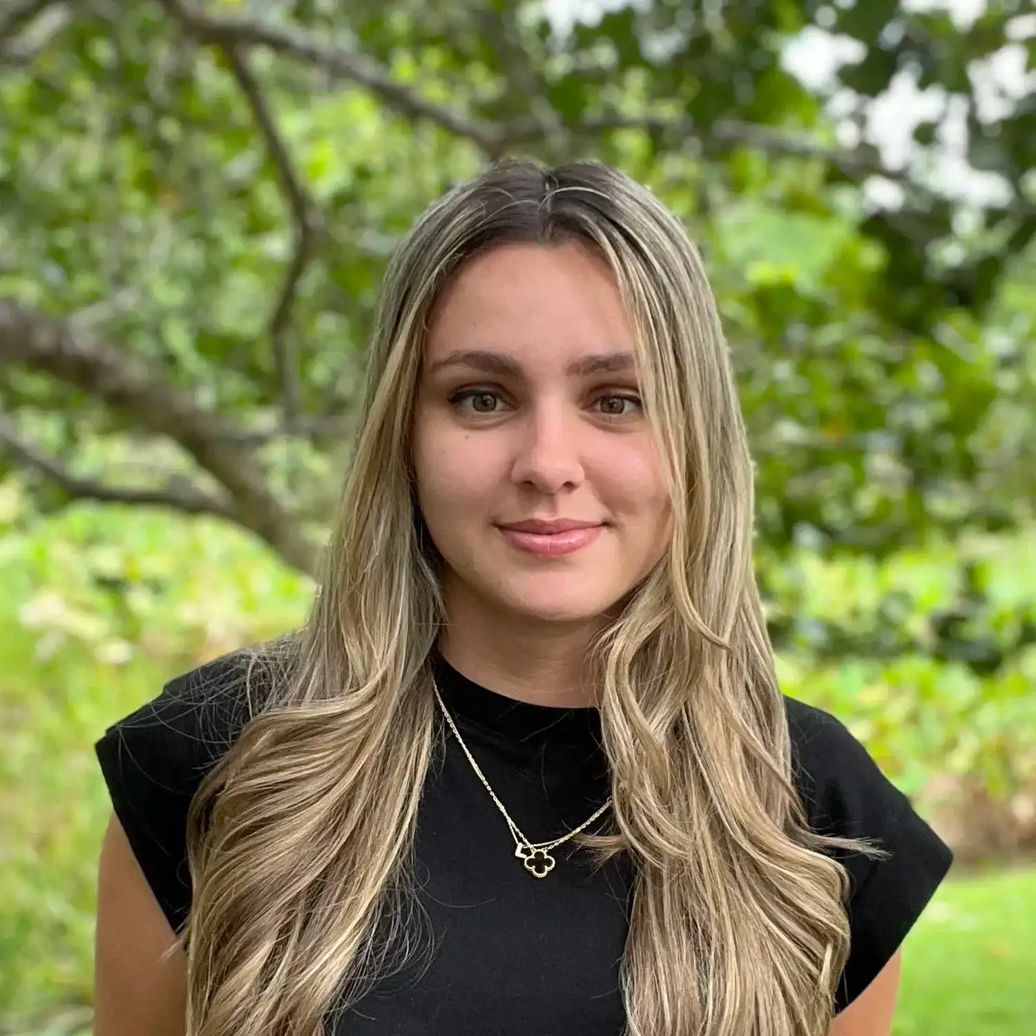 Portrait of Leslie Fonte, a professional stylist at Grey and Sage Salon, showcasing their expertise and style.