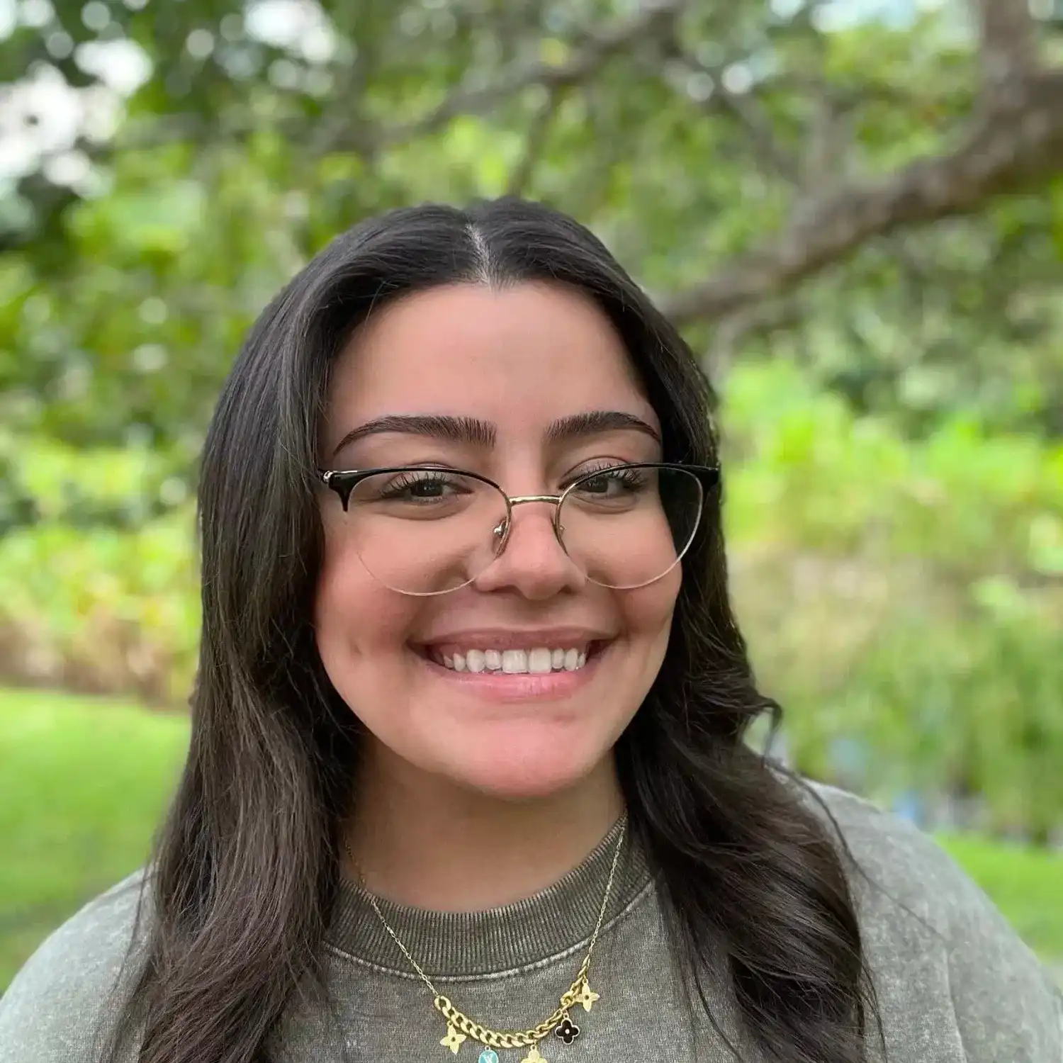 Portrait of Serene Mansour, a professional stylist at Grey and Sage Salon, showcasing their expertise and style.