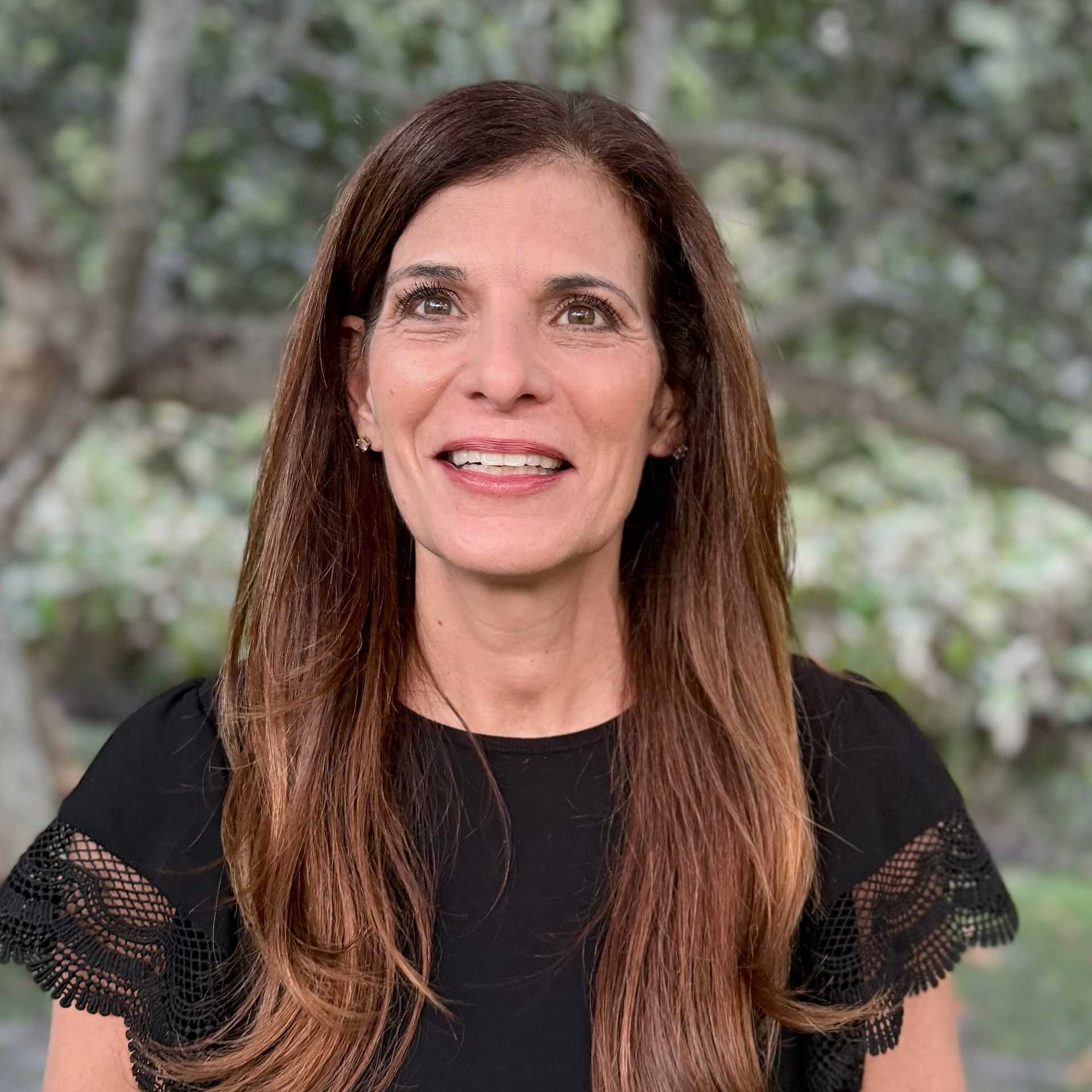 Portrait of Anita Mittelstaedt, a professional stylist at Grey and Sage Salon, showcasing their expertise and style.