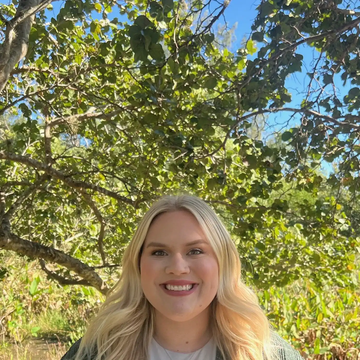 Portrait of Brielle Azcona, a professional stylist at Grey and Sage Salon, showcasing their expertise and style.