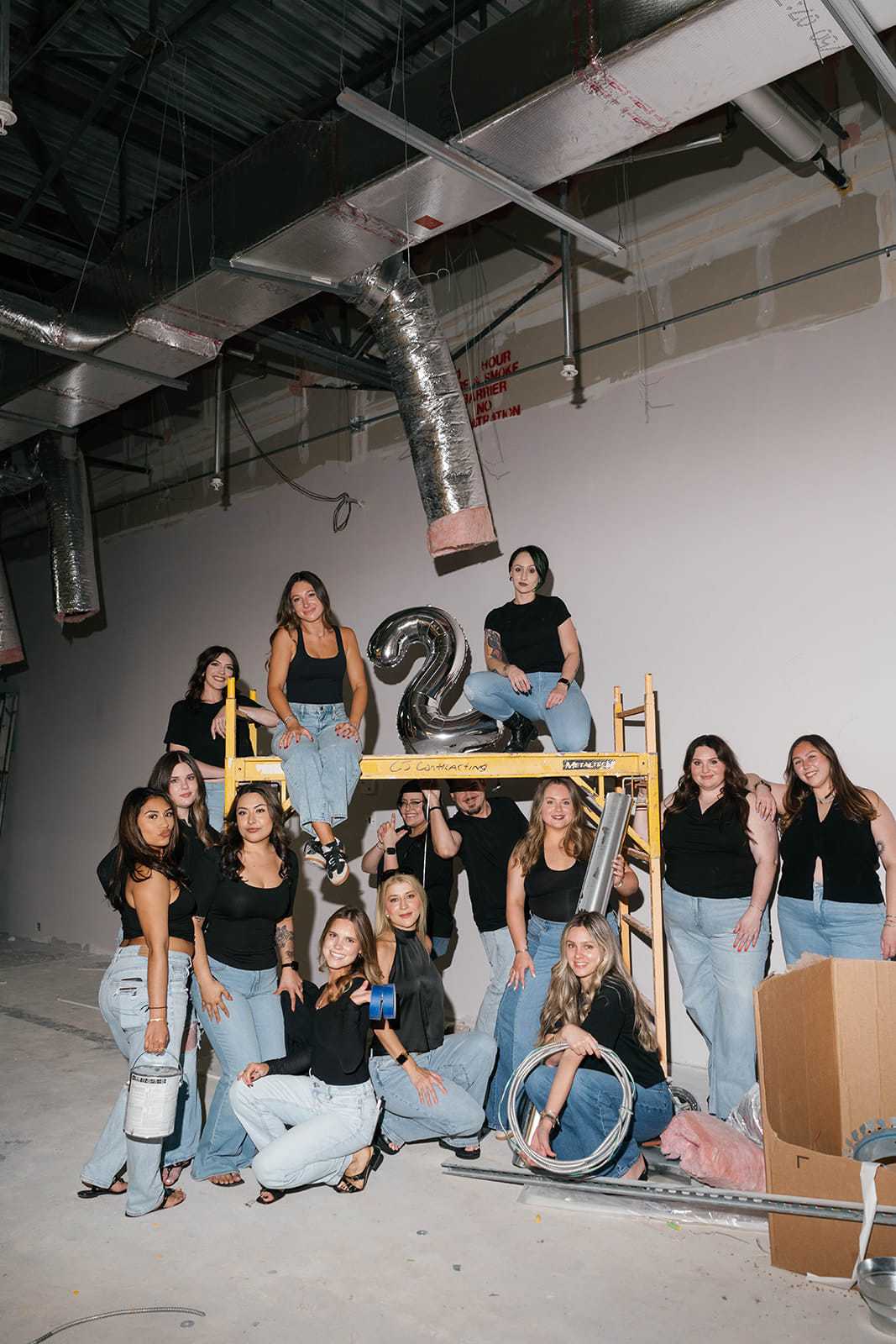 Grey & Sage Salon team celebrating their two-year anniversary and new salon expansion in Wellington,